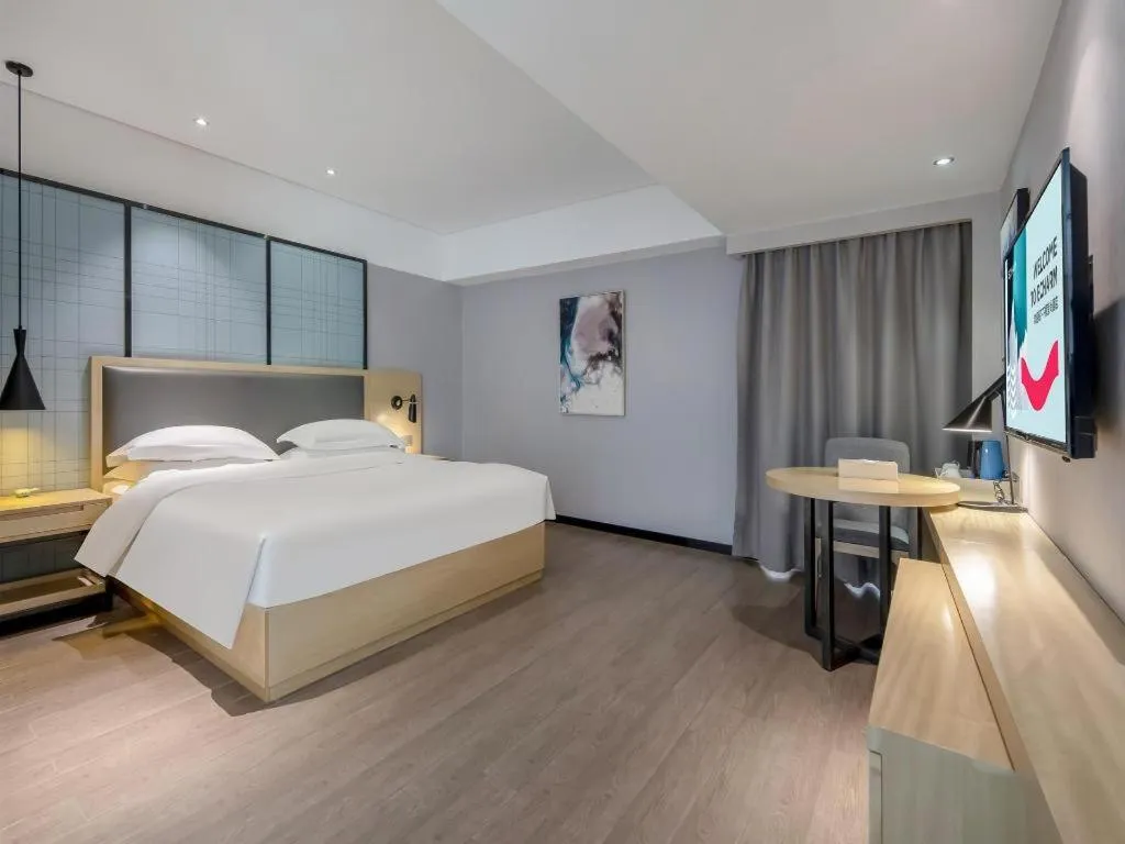 Bed in Echarm Hotel Beihai Railway Station