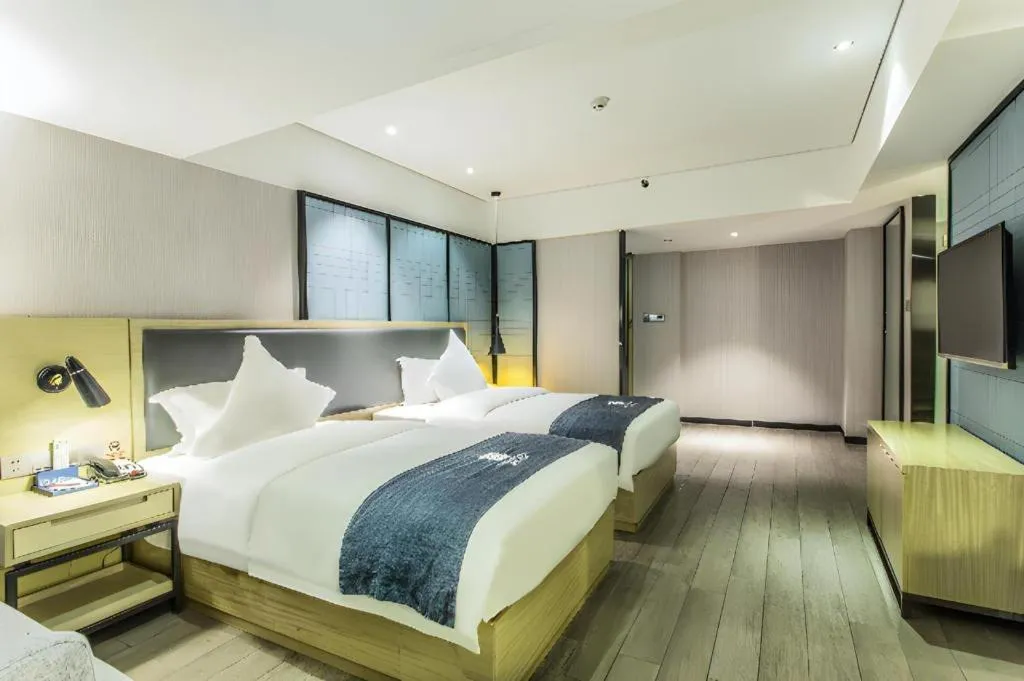 Bed in Echarm Hotel Beihai Railway Station