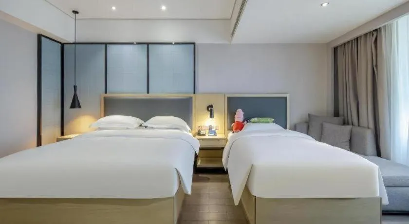 Bed in Echarm Hotel Beihai Railway Station