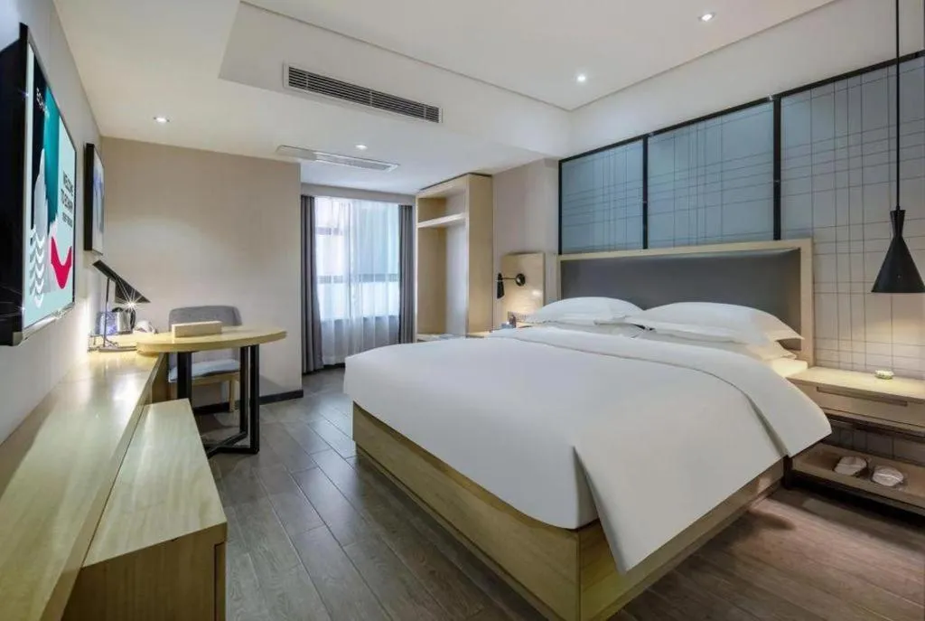 Bed in Echarm Hotel Beihai Railway Station