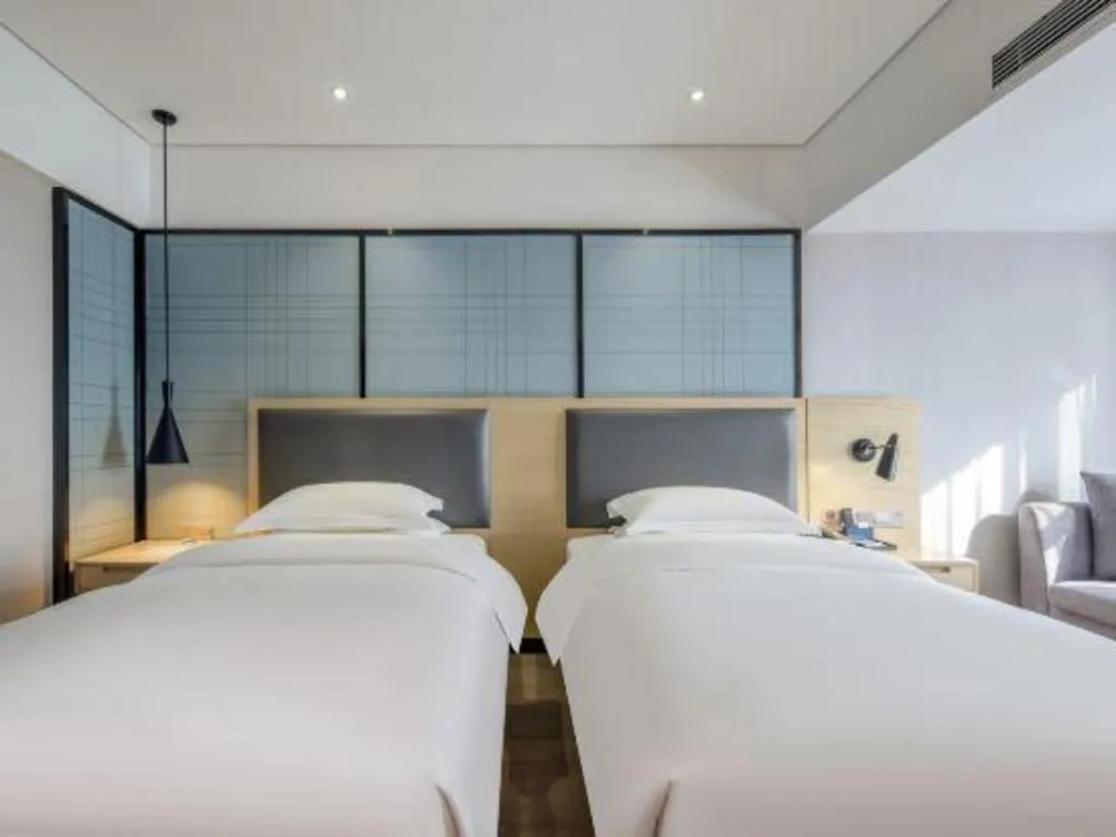 Bed in Echarm Hotel Beihai Railway Station