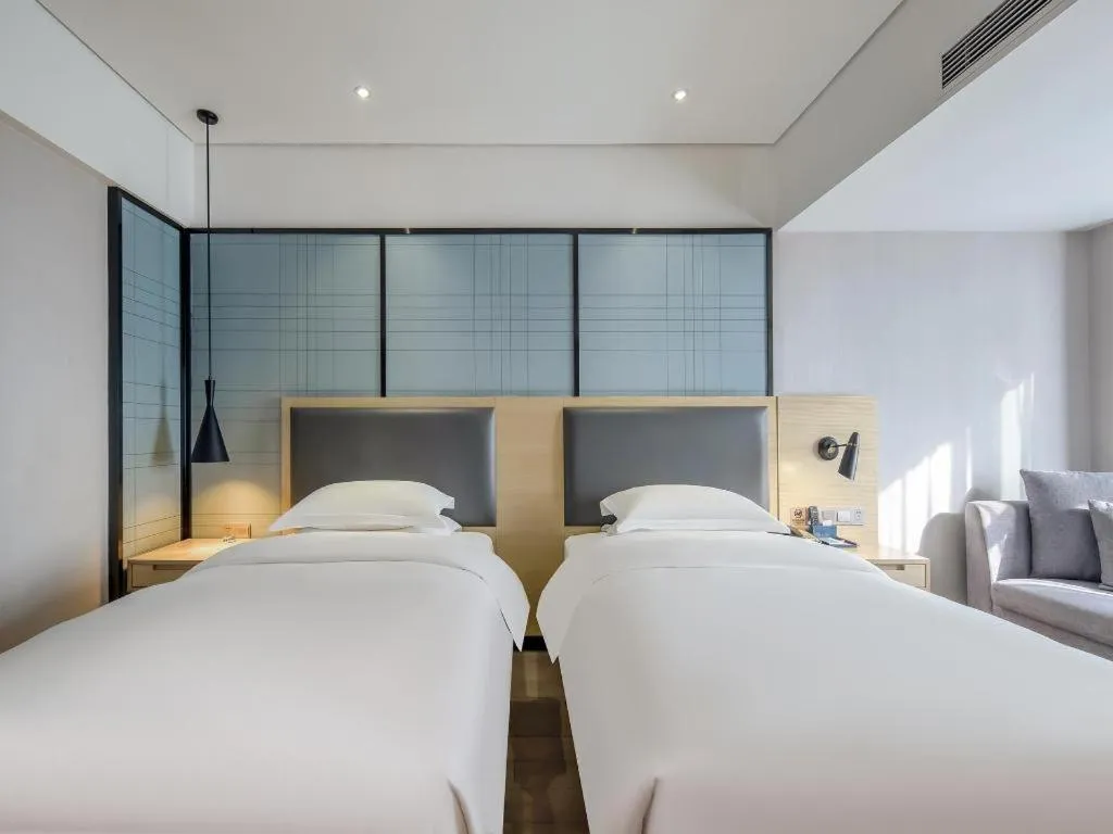 Bed in Echarm Hotel Beihai Railway Station