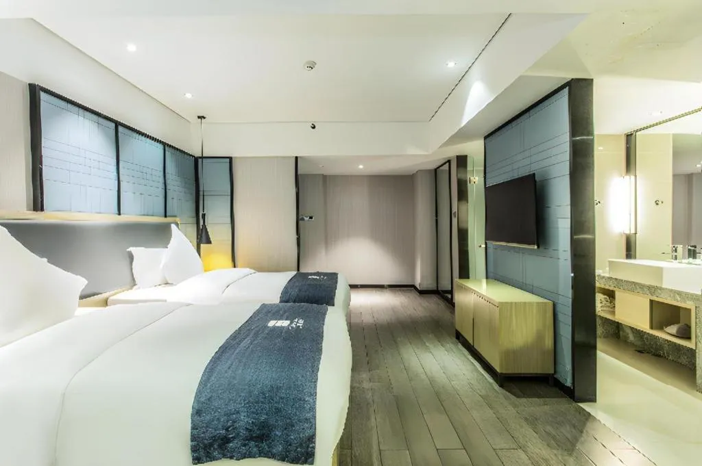 Bed in Echarm Hotel Beihai Railway Station