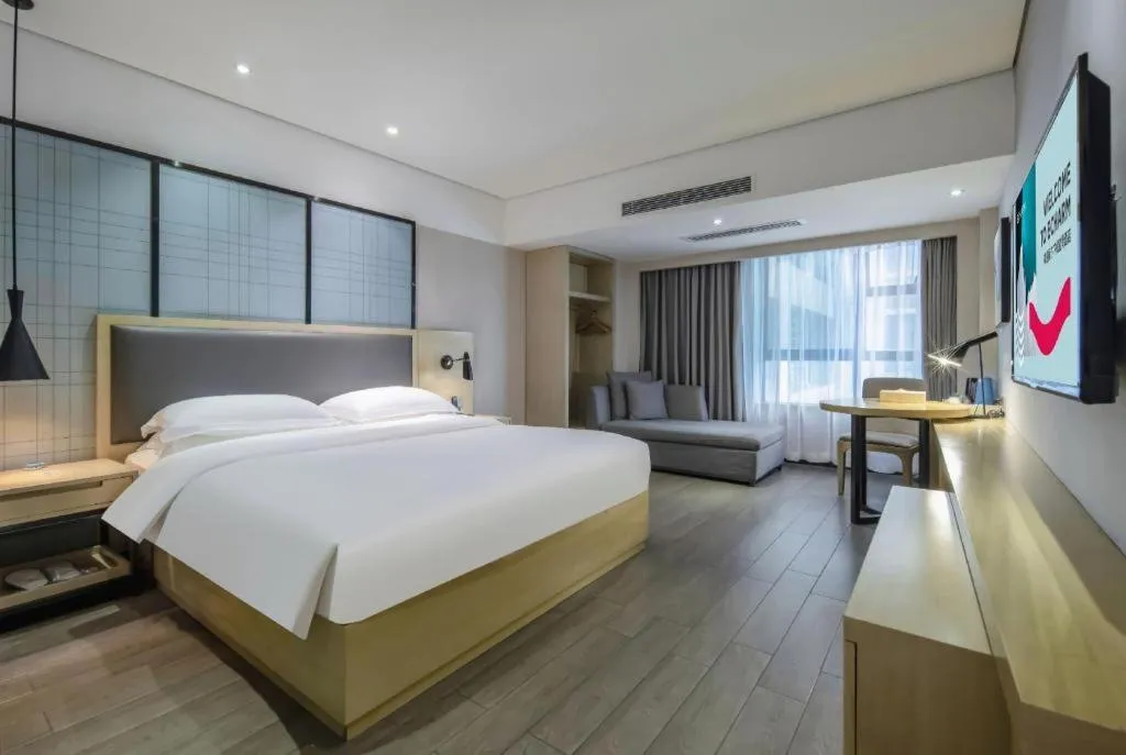 Bed in Echarm Hotel Beihai Railway Station