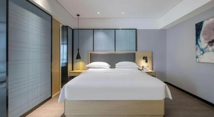 Bed in Echarm Hotel Beihai Railway Station