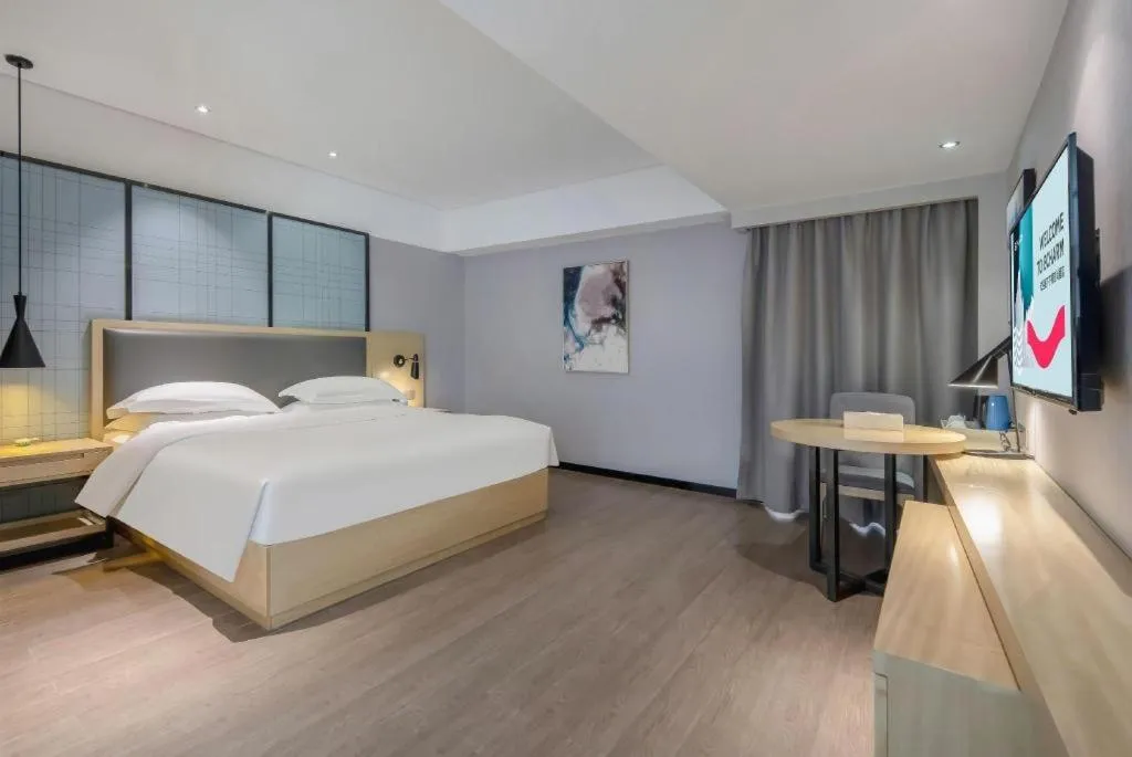 Bed in Echarm Hotel Beihai Railway Station