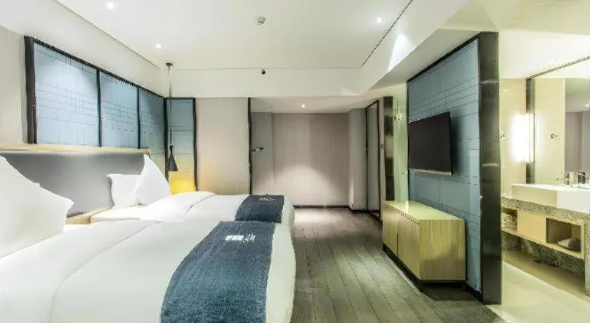 Bed in Echarm Hotel Beihai Railway Station