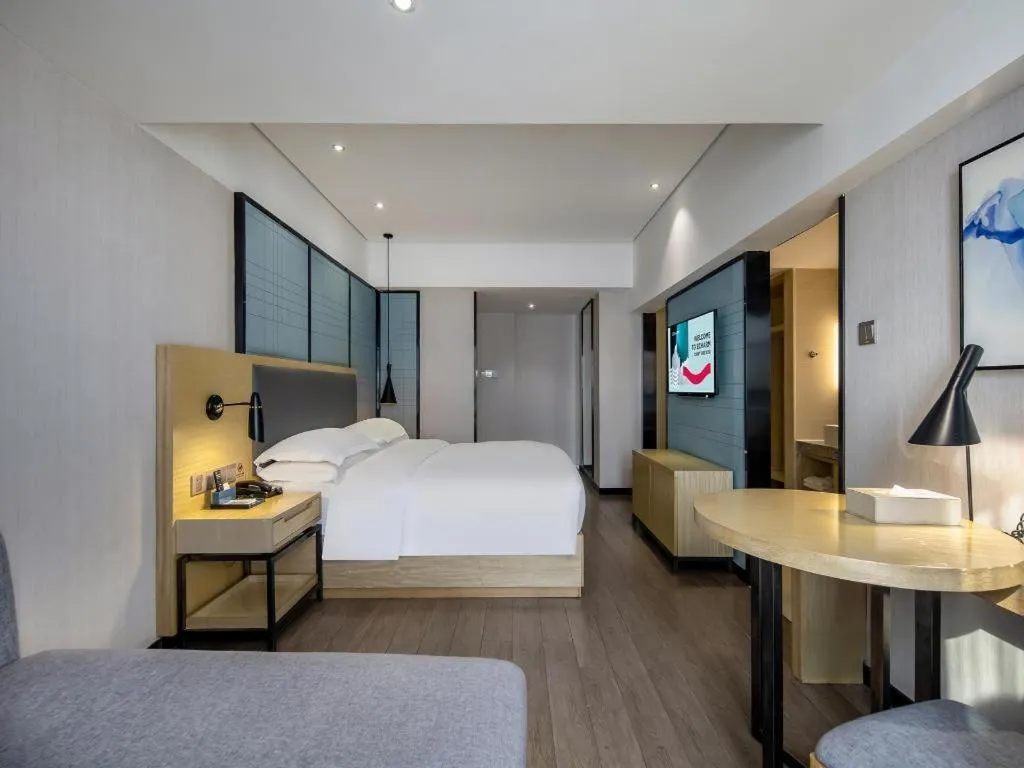 Bed in Echarm Hotel Beihai Railway Station