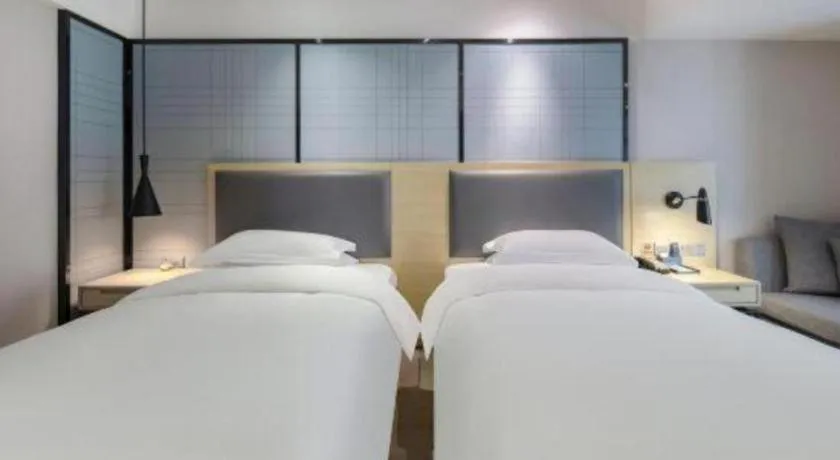 Bed in Echarm Hotel Beihai Railway Station