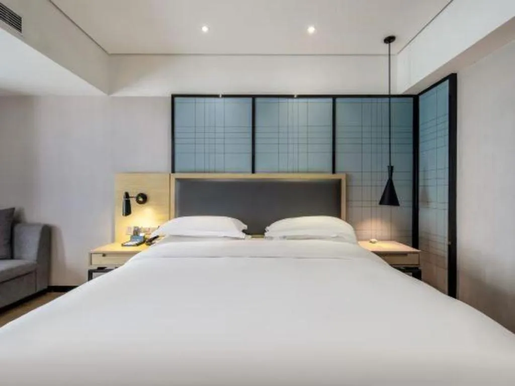 Bed in Echarm Hotel Beihai Railway Station