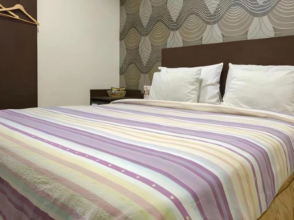 Bed in Vindhika Hotel