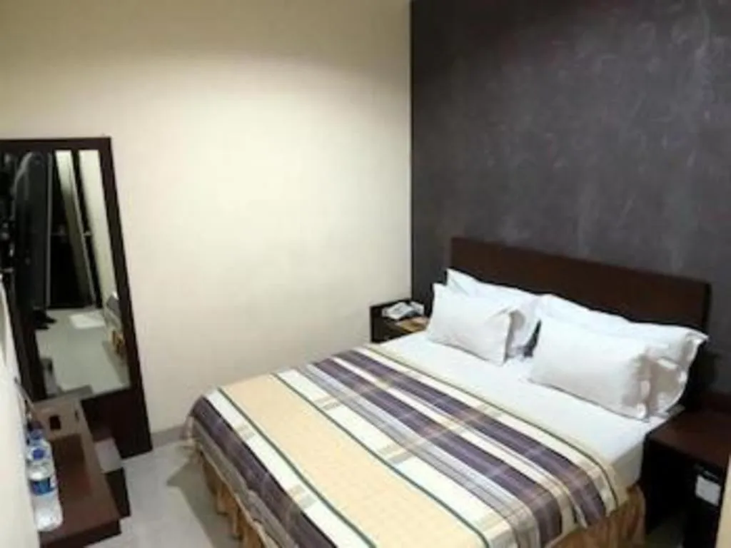 Bed in Vindhika Hotel