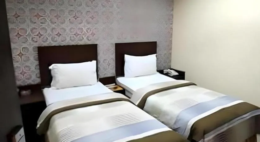 Bed in Vindhika Hotel
