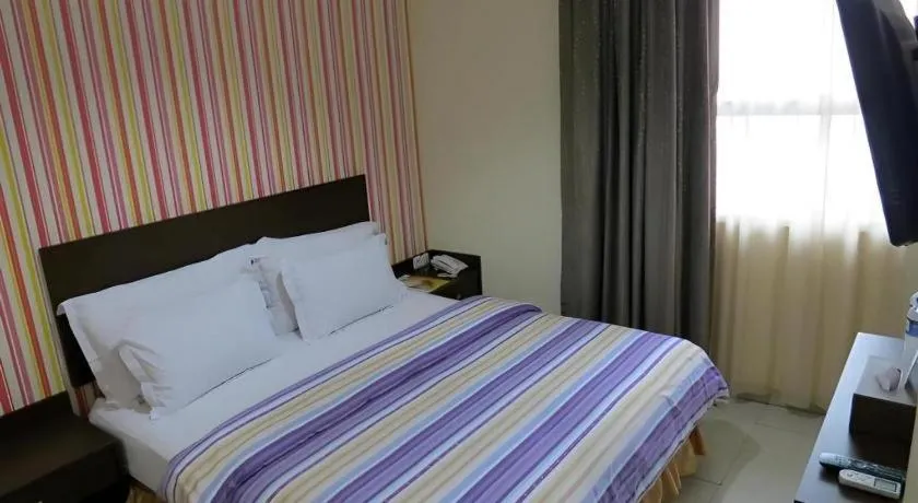 Bed in Vindhika Hotel