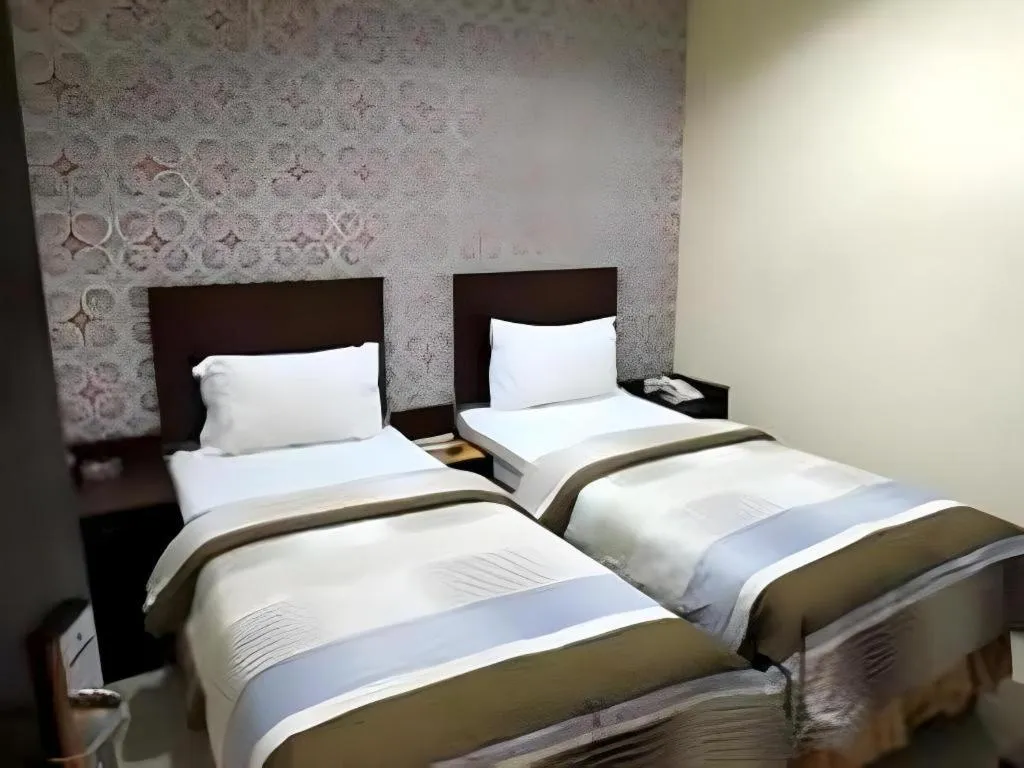 Bed in Vindhika Hotel