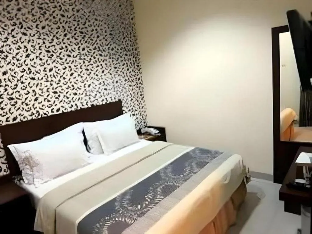 Bed in Vindhika Hotel