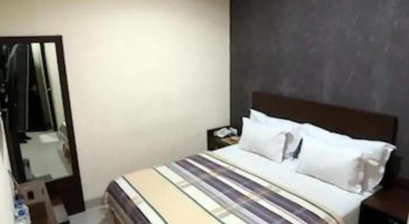 Bed in Vindhika Hotel