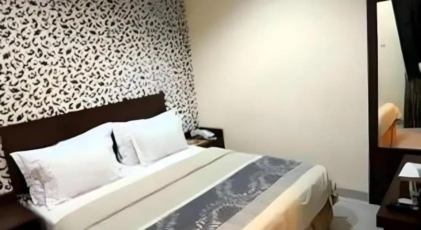 Bed in Vindhika Hotel