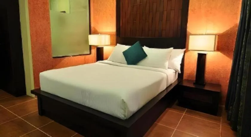 Bed in Home Crest Hotel