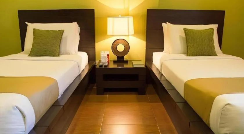 Bed in Home Crest Hotel