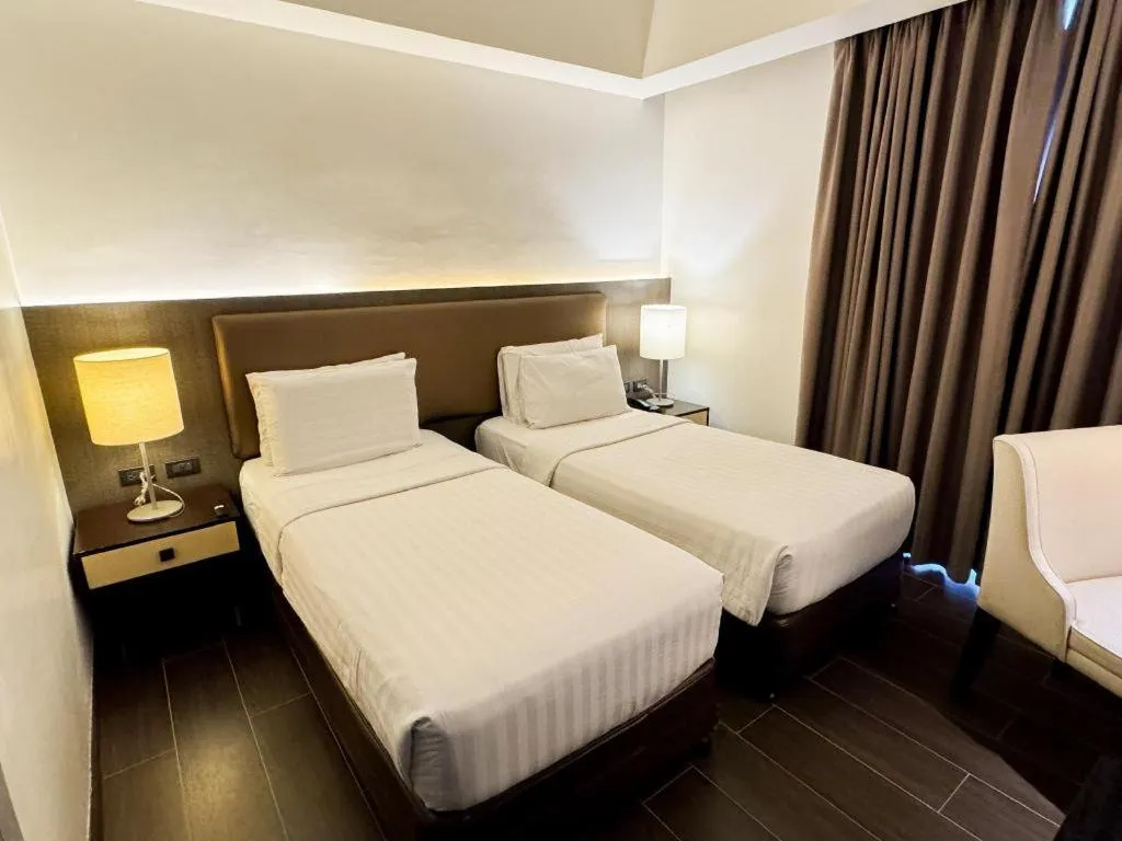 Bed in Home Crest Hotel