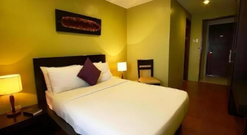 Bed in Home Crest Hotel