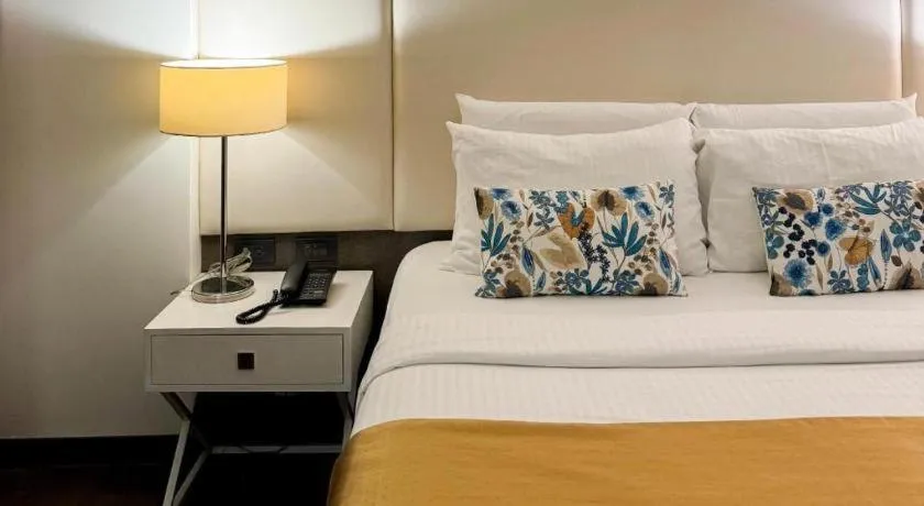 Bed in Home Crest Hotel