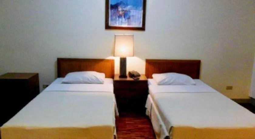 Bed in Amorsolo Mansion Hotel