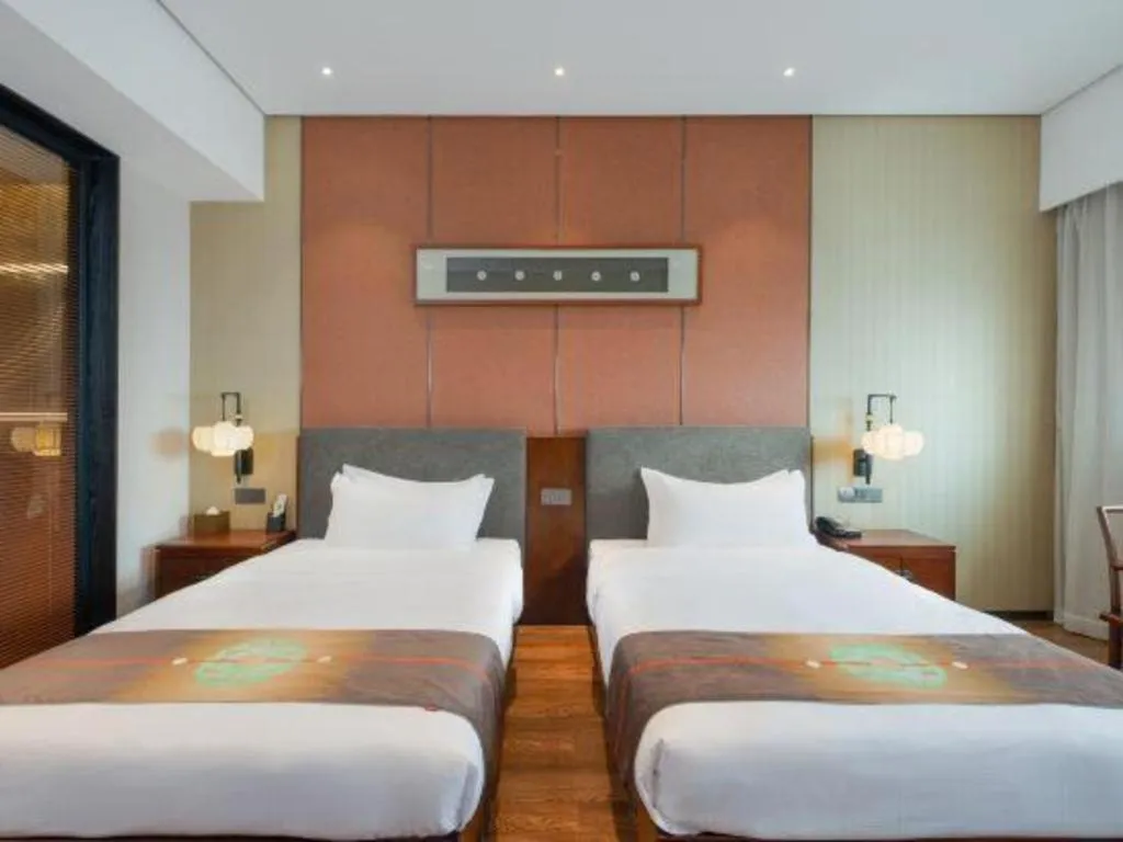 Bed in Rezen Hotel Pasonda Junyu