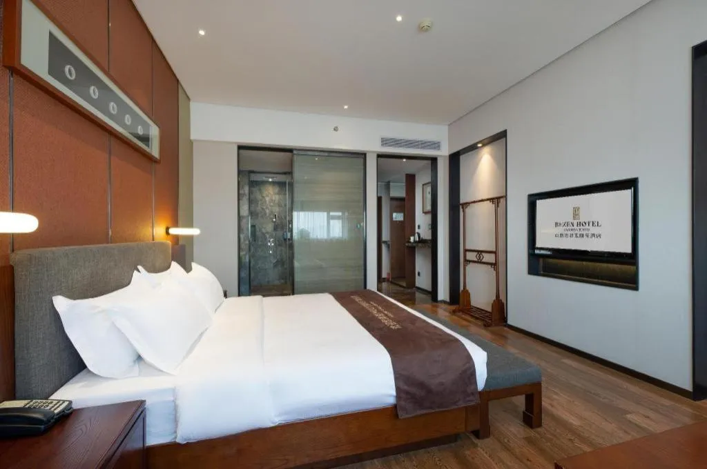 Bed in Rezen Hotel Pasonda Junyu