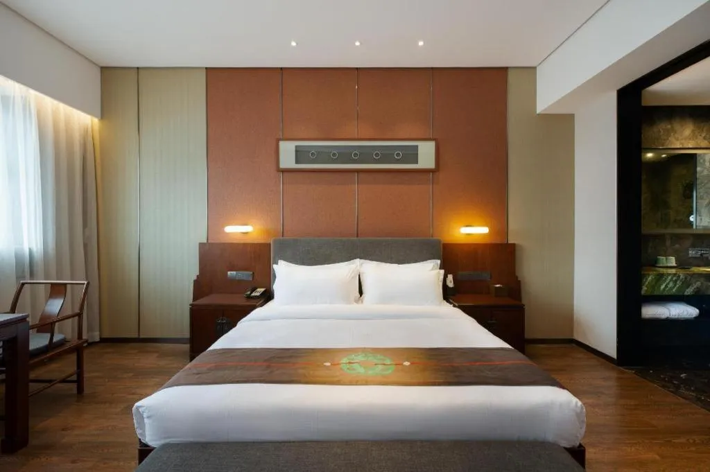 Bed in Rezen Hotel Pasonda Junyu