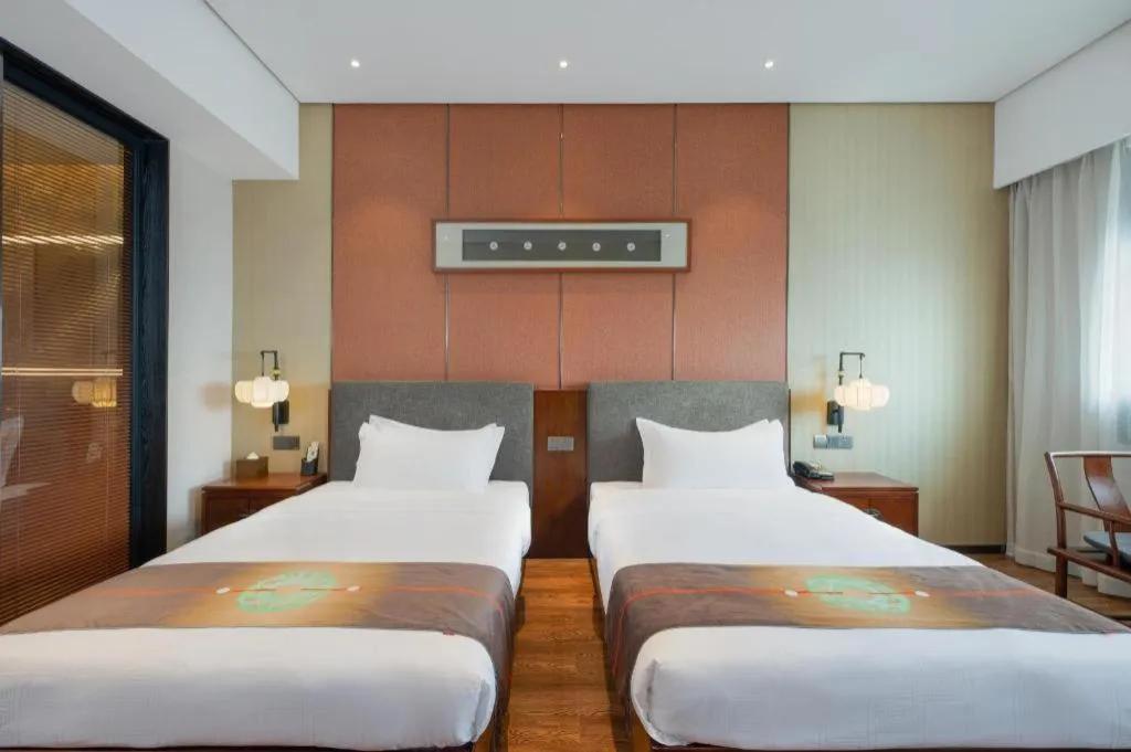 Bed in Rezen Hotel Pasonda Junyu