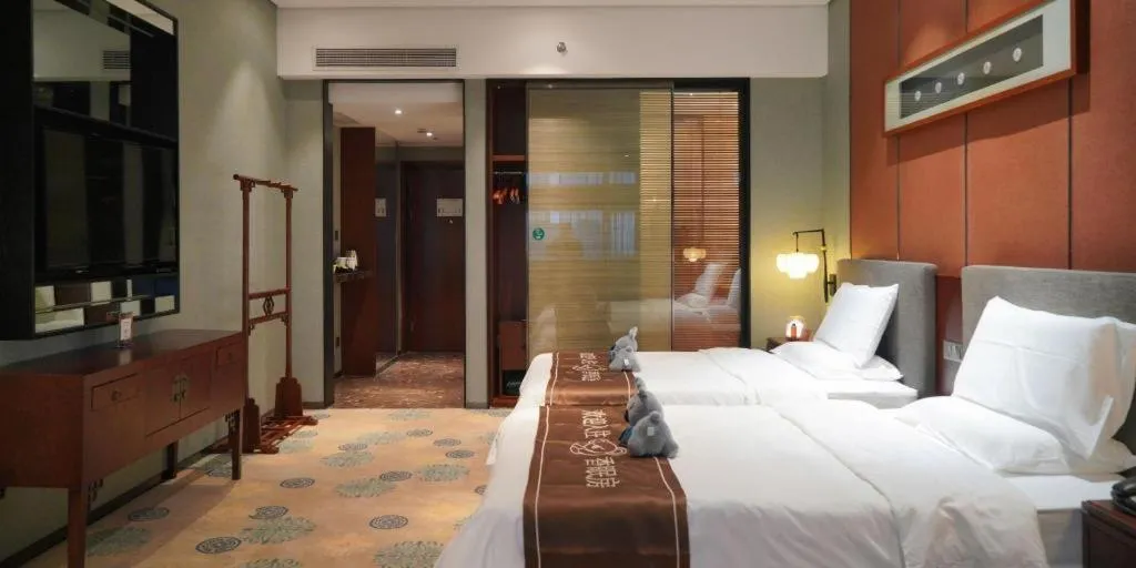 Bed in Rezen Hotel Pasonda Junyu