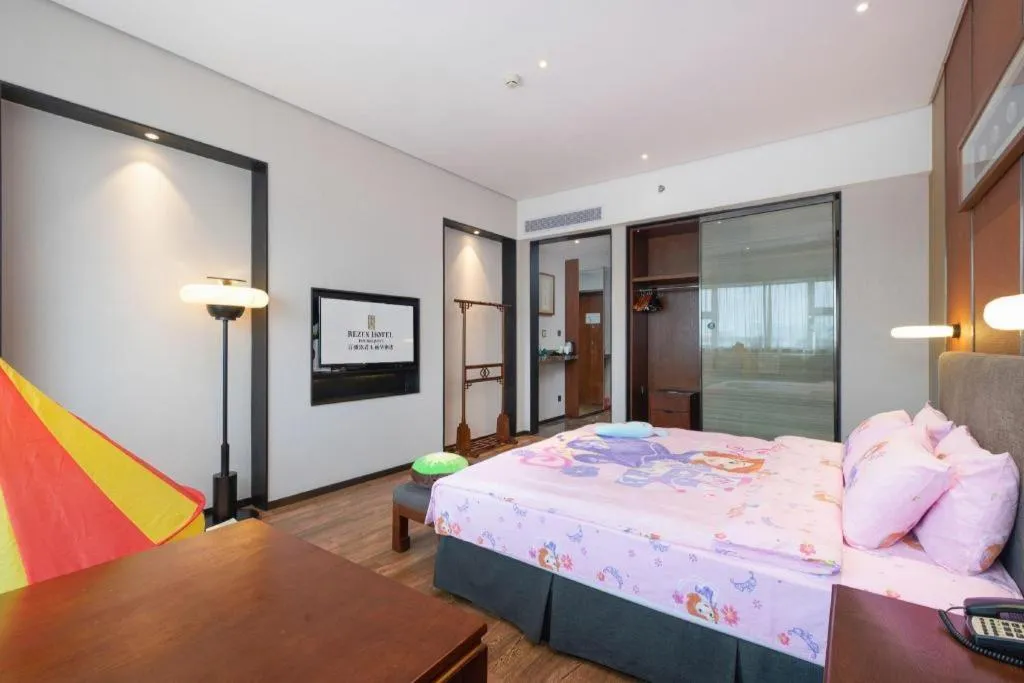 Bed in Rezen Hotel Pasonda Junyu