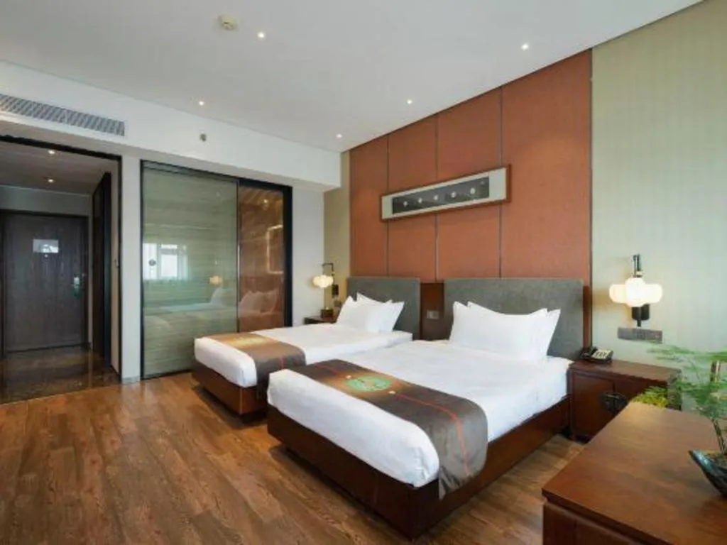 Bed in Rezen Hotel Pasonda Junyu