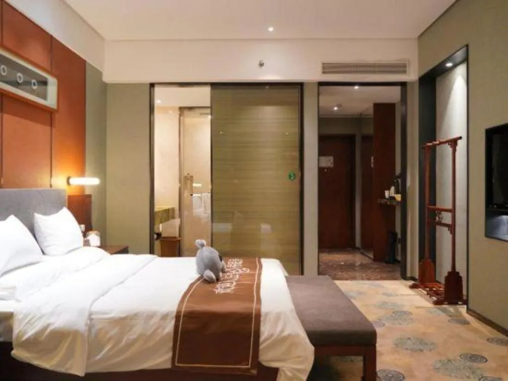 Bed in Rezen Hotel Pasonda Junyu