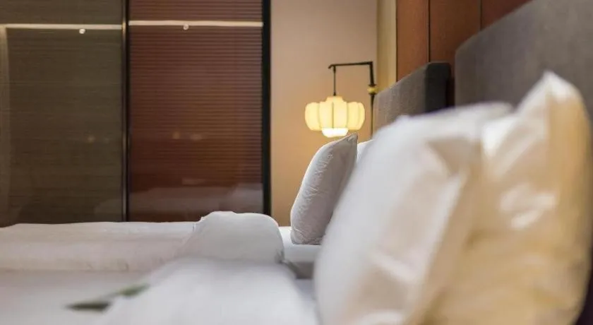 Bed in Rezen Hotel Pasonda Junyu