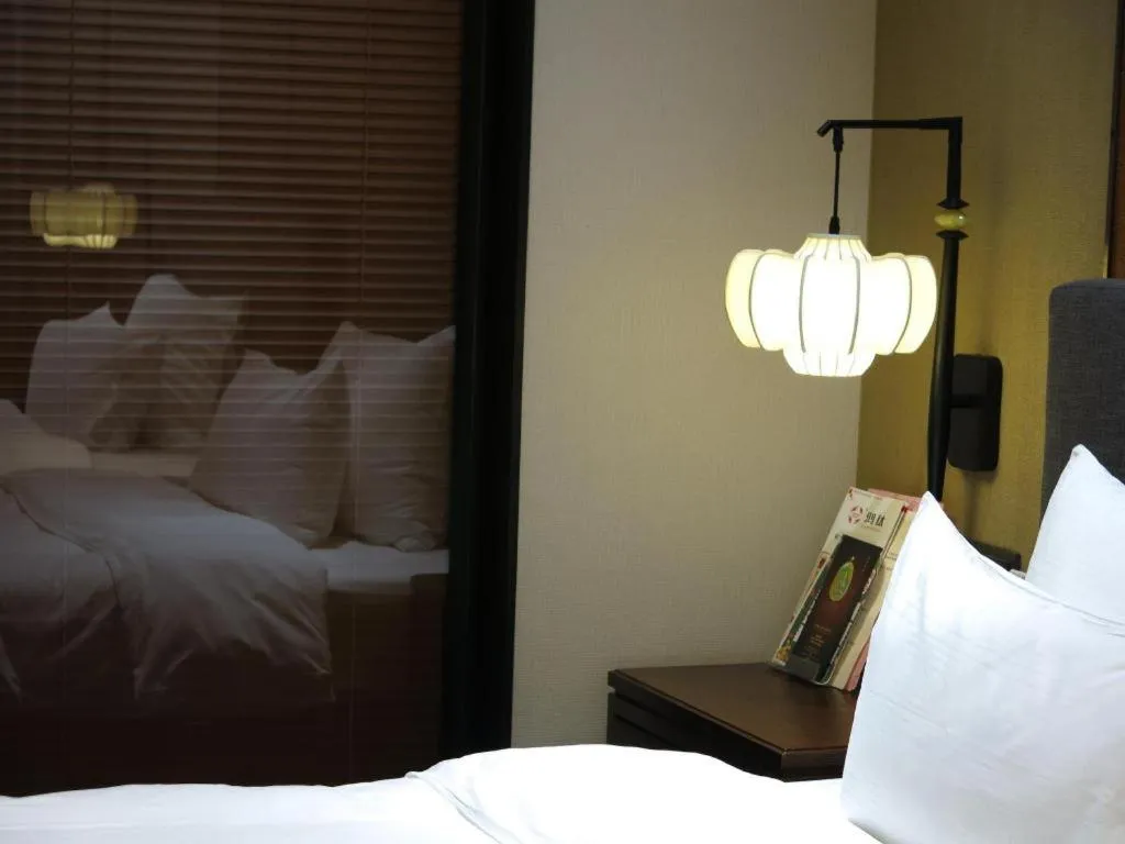 Bed in Rezen Hotel Pasonda Junyu