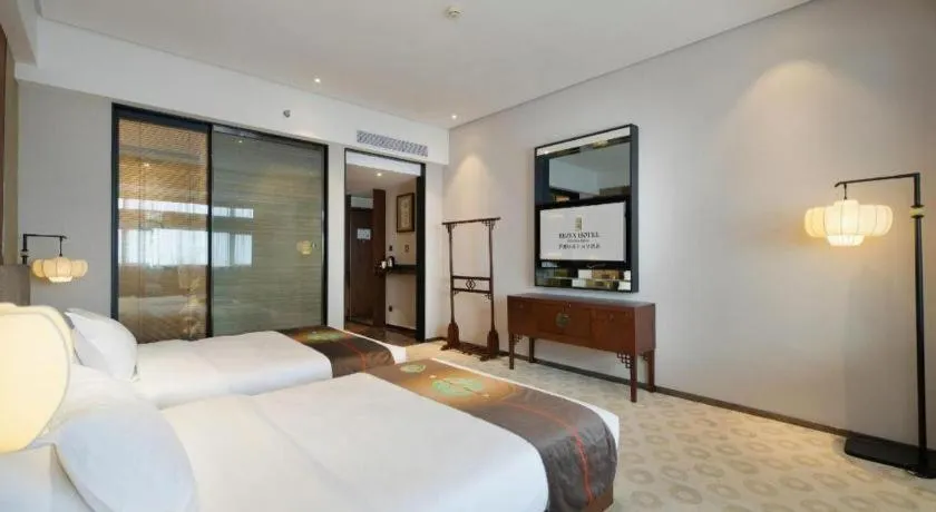 Bed in Rezen Hotel Pasonda Junyu