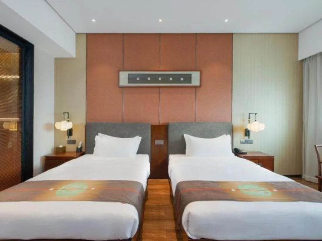 Bed in Rezen Hotel Pasonda Junyu