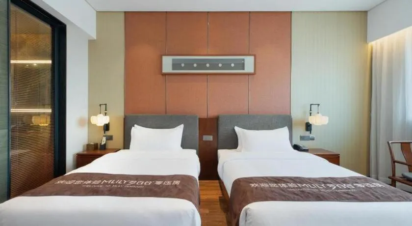 Bed in Rezen Hotel Pasonda Junyu