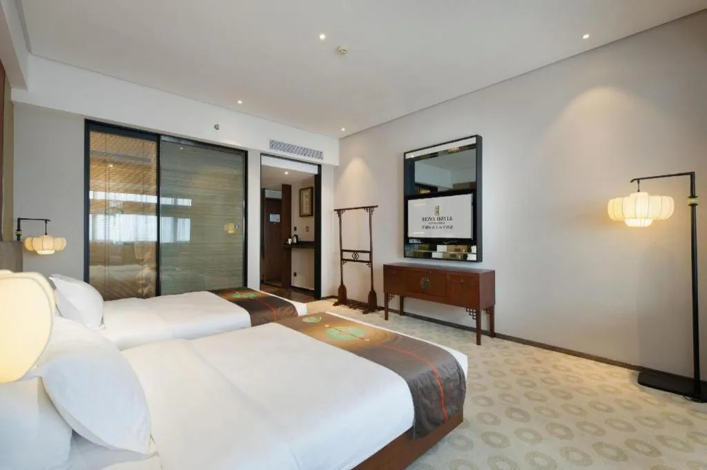 Bed in Rezen Hotel Pasonda Junyu