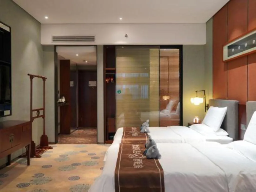 Bed in Rezen Hotel Pasonda Junyu