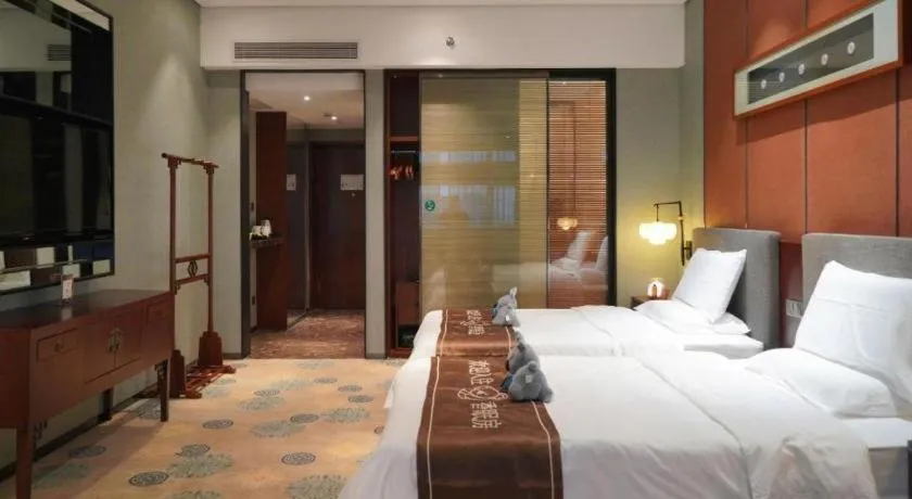 Bed in Rezen Hotel Pasonda Junyu