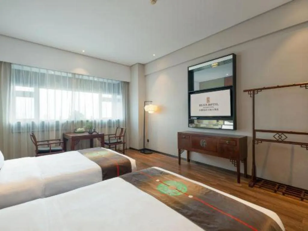 Bed in Rezen Hotel Pasonda Junyu