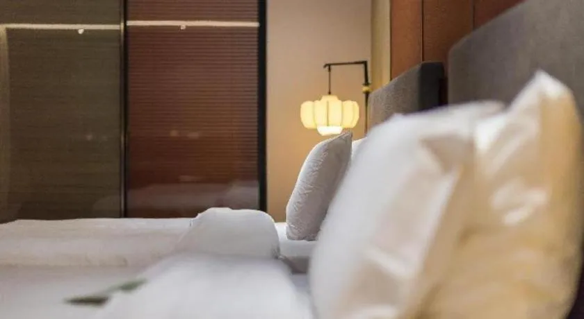 Bed in Rezen Hotel Pasonda Junyu