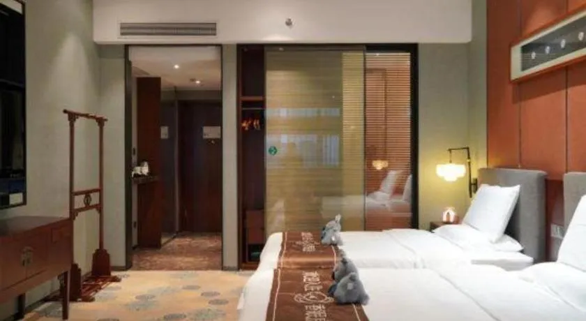 Bed in Rezen Hotel Pasonda Junyu