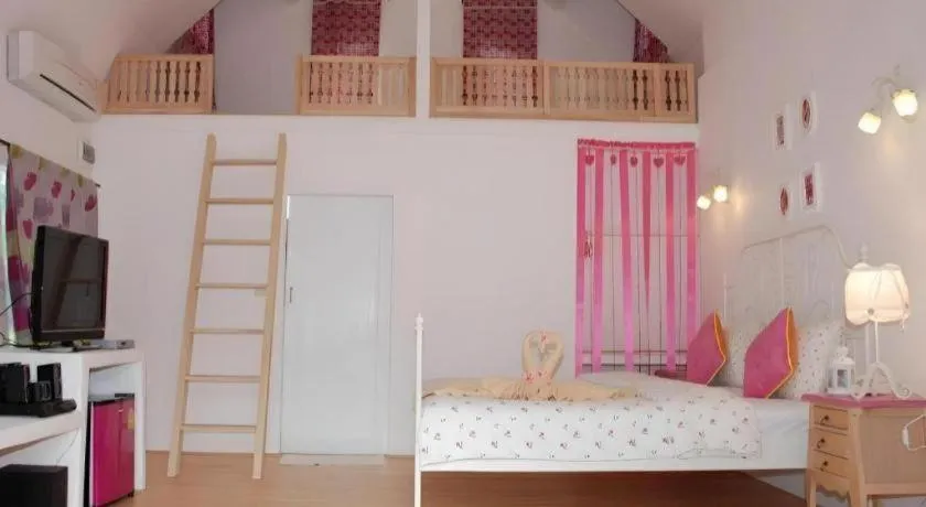 Bed in Rak Na Suan Pueng Resort