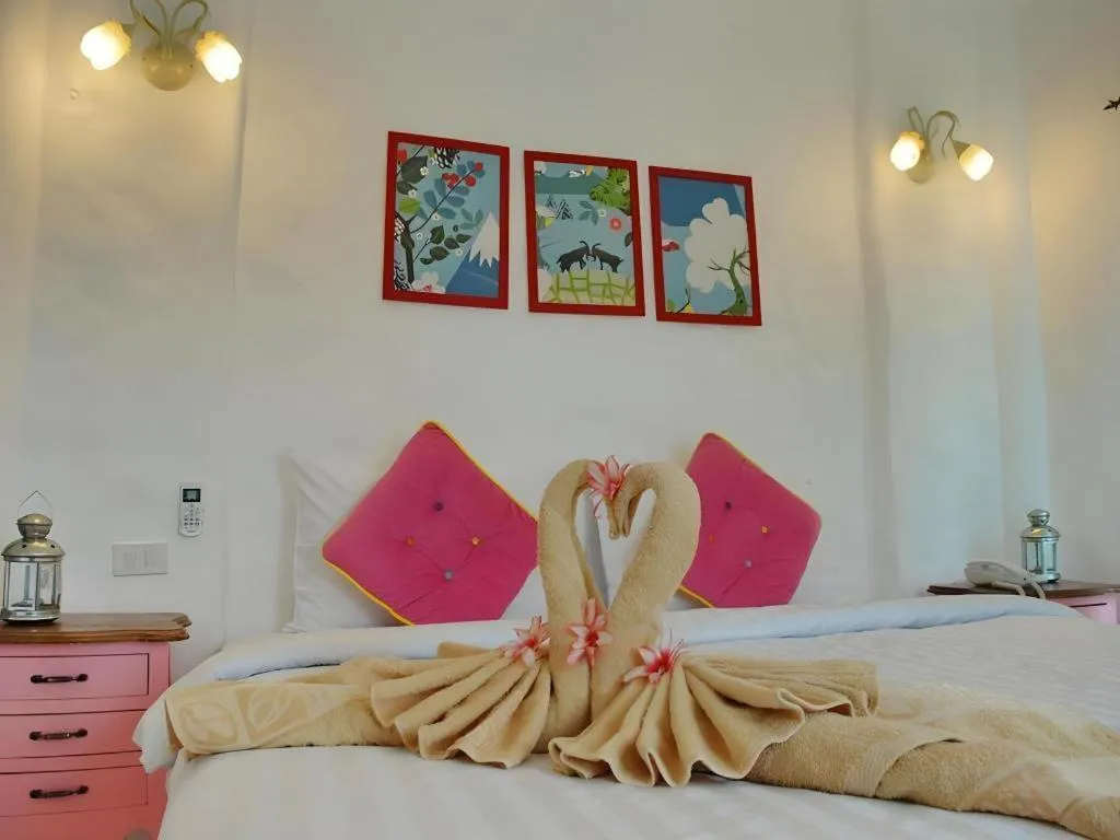 Bed in Rak Na Suan Pueng Resort