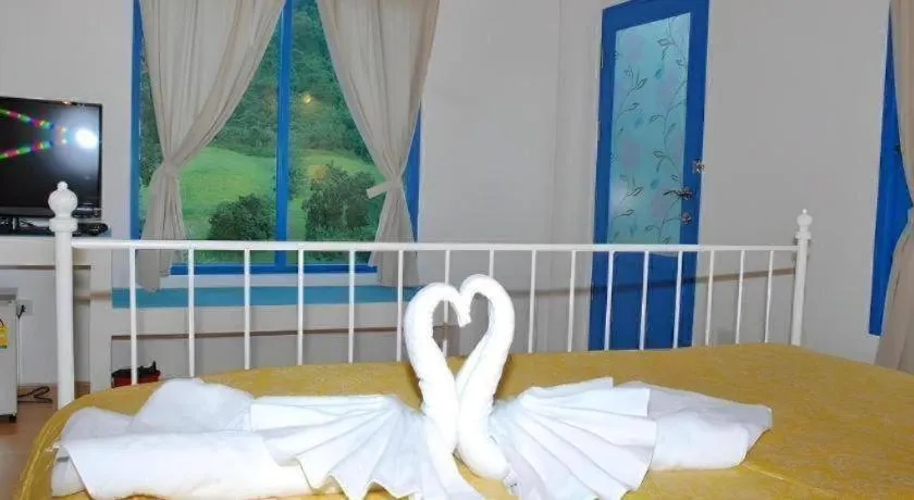 Bed in Rak Na Suan Pueng Resort